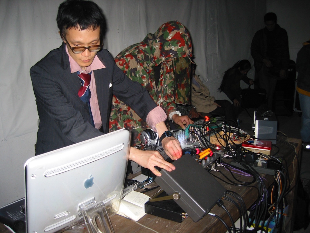 2002 Song of the Fractal Beast performance; left: Lin Chi-wei, right: fish